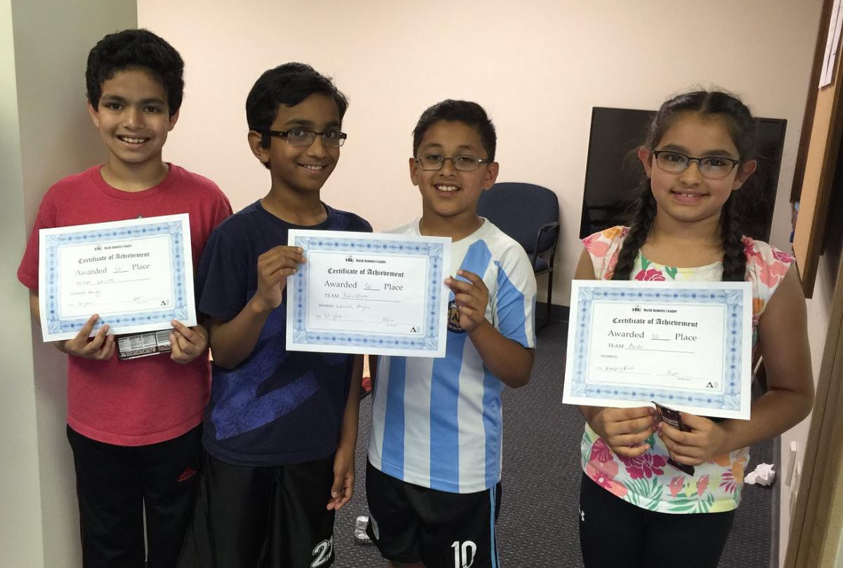 Students with their certificates from World Robotics League Competitions.